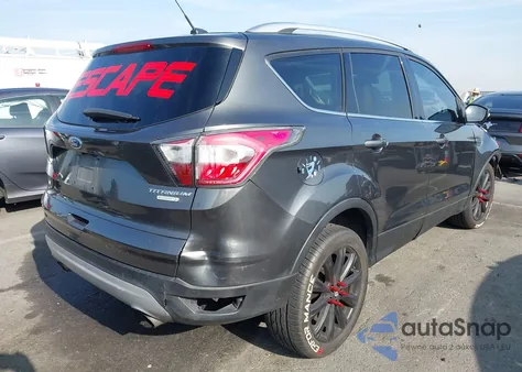 2017 Ford Escape Titanium z USA, uszkodzony, nr VIN 1FMCU0J90HUA04306